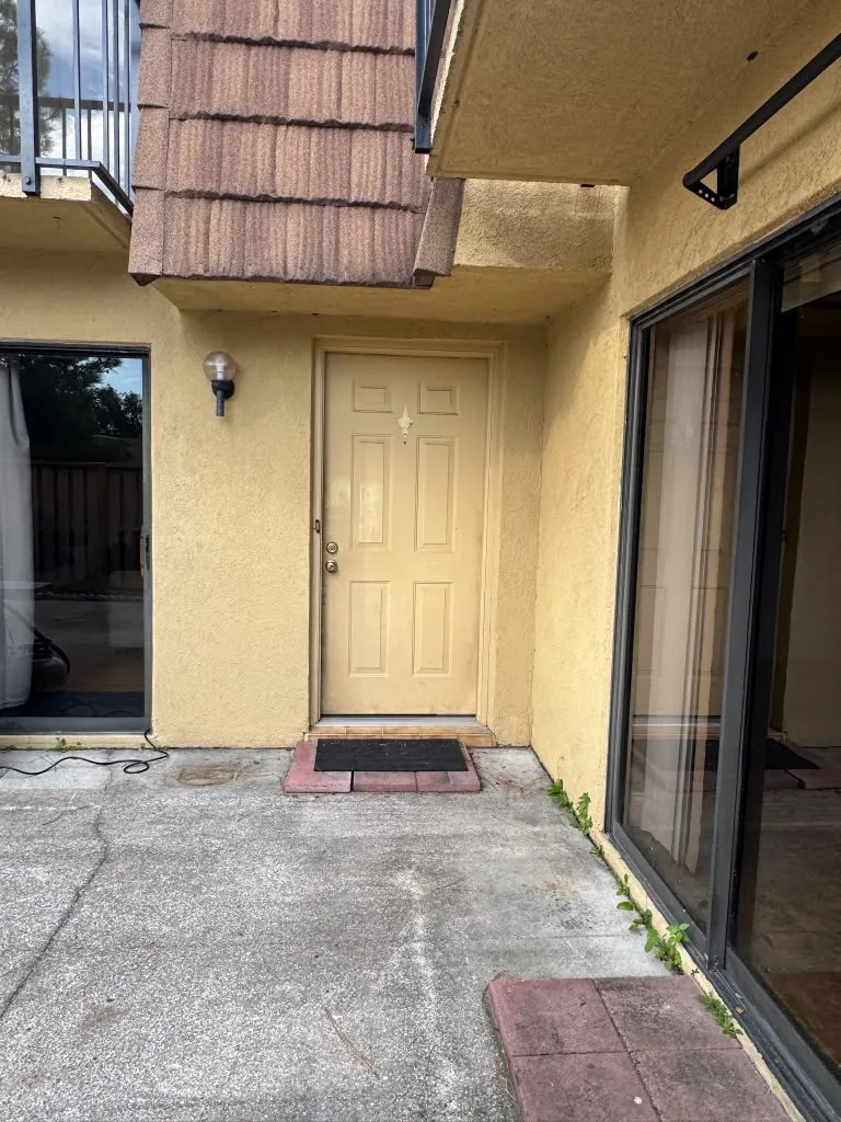 Before: faded tan front entry door