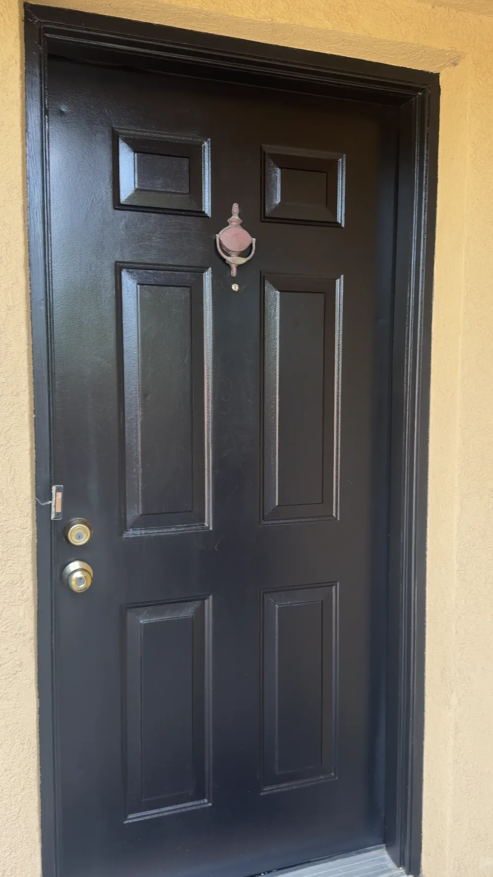 Front entry door painted glossy black