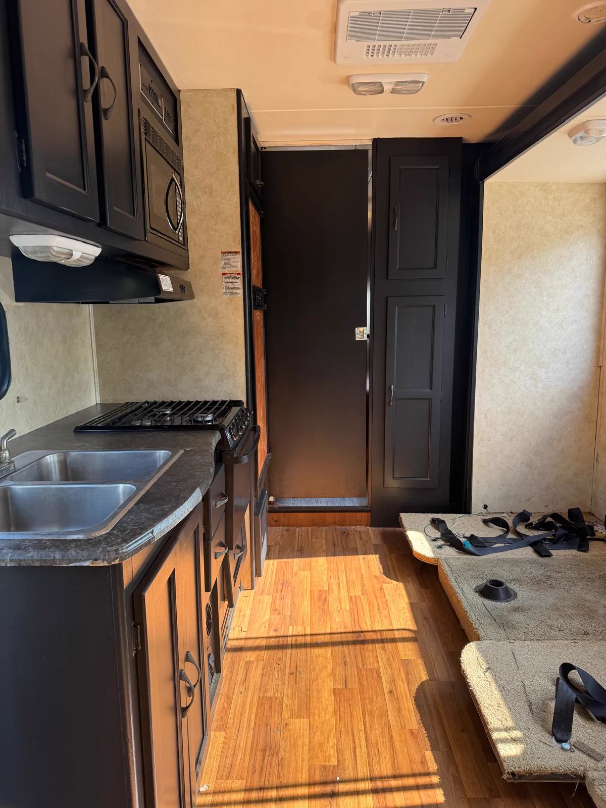 Motorhome kitchen with every cabinet painted black