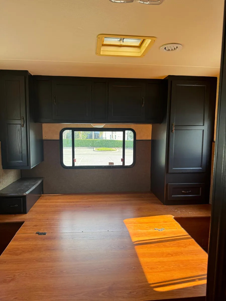 The same back wall with every cabinet painted black