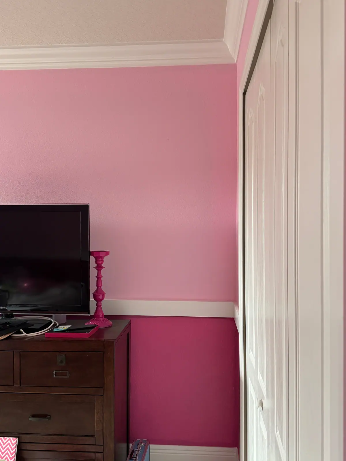 After: soft pink above the chair rail and deep magenta below